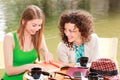 Two beautiful girls chatting over a coffee Royalty Free Stock Photo