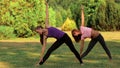 Two beautiful girls doing yoga