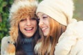 Two beautiful girls having fun outdoor on sunny autumn day Royalty Free Stock Photo