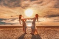 Two beautiful girls having fun at sunset on the beach Royalty Free Stock Photo