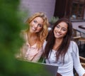 Two beautiful girls with laptop Royalty Free Stock Photo