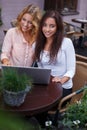 Two beautiful girls with laptop Royalty Free Stock Photo