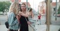 Two beautiful girls looking at clothes in a shop window. Royalty Free Stock Photo