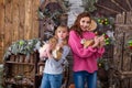 Two beautiful girls posing in Christmas decorations Royalty Free Stock Photo