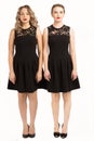 Two beautiful girls in the same black dress Royalty Free Stock Photo