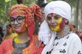 Two beautiful girls smeared with holi colours