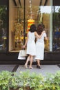 Two beautiful girls window shopping in the city Royalty Free Stock Photo