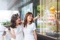 Two beautiful girls window shopping in the city Royalty Free Stock Photo