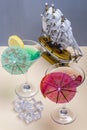 Two glasses with colorful cocktails and a model ship in the background Royalty Free Stock Photo