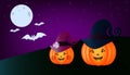 Two beautiful Halloween pumpkins stand in the foreground of the picture on the dark green grass, and behind, on a purple