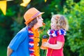 Two beautiful happy kids Dutch football supporters Royalty Free Stock Photo