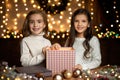 Little child girl opening magic Christmas gift box Royalty Free Stock Photo