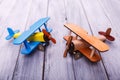 Childrens toy airplanes on the wooden background. Game concept. Royalty Free Stock Photo