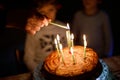 Two beautiful kids, little preschool boys celebrating birthday and blowing candles Royalty Free Stock Photo