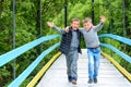 Two beautiful little guys running along the bridge in the Carpathians Royalty Free Stock Photo