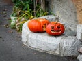 Two beautiful orange pumpkin carvings for the Halloween party