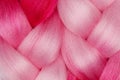 Two beautiful pink kanekalon on white background close-up. Royalty Free Stock Photo
