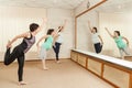 Two beautiful pregnant women doing yoga with a trainer Royalty Free Stock Photo