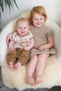 Two redheaded child on a chair Royalty Free Stock Photo