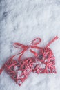 Two beautiful romantic vintage red hearts tied together with ribbon on white snow background. Love and St. Valentines Day concept Royalty Free Stock Photo