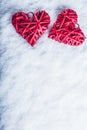 Two beautiful romantic vintage red hearts together on a white snow background. Love and St. Valentines Day concept. Royalty Free Stock Photo