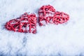 Two beautiful romantic vintage red hearts together on a white snow background. Love and St. Valentines Day concept.