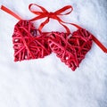 Two beautiful romantic vintage red hearts together on a white snow winter background. Love and St. Valentines Day concept Royalty Free Stock Photo