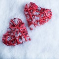 Two beautiful romantic vintage red hearts together on white snow winter background. Love and St. Valentines Day concept Royalty Free Stock Photo