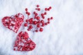 Two beautiful romantic vintage red hearts together on white snow winter background. Love and St. Valentines Day concept Royalty Free Stock Photo
