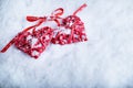 Two beautiful romantic vintage red hearts together on a white snow winter background. Love and St. Valentines Day concept Royalty Free Stock Photo