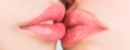 Two beautiful sexy lesbians in love. Lip care and beauty. Closeup of beautiful young woman healthy lips. Lesbian couple