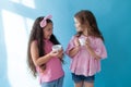 Two beautiful small girls girlfriend sister in pink clothes Royalty Free Stock Photo