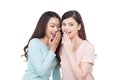 Two beautiful smiling girls sharing a secret Royalty Free Stock Photo