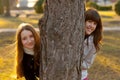 Two beautiful teenage girls having fun in the park