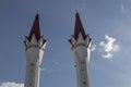 Two beautiful towers of the mosque against the background of the sky.