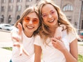 Two beautiful trendy girls posing in the street Royalty Free Stock Photo