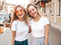 Two beautiful trendy girls posing in the street Royalty Free Stock Photo