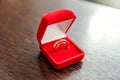 Two beautiful wedding rings on red jewelry box on light background Royalty Free Stock Photo