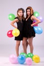 Two beautiful women, with colored ballons Royalty Free Stock Photo