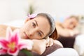 Two beautiful women getting massage in spa Royalty Free Stock Photo