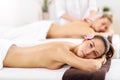 Two beautiful women getting massage in spa Royalty Free Stock Photo