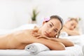 Two beautiful women getting massage in spa Royalty Free Stock Photo