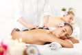 Two beautiful women getting massage in spa Royalty Free Stock Photo