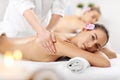 Two beautiful women getting massage in spa Royalty Free Stock Photo