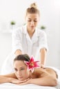 Two beautiful women getting massage in spa Royalty Free Stock Photo