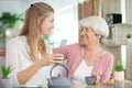 two beautiful women-a mother and daughte drink tea