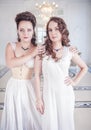 Two beautiful women in old-fashioned negligee Royalty Free Stock Photo