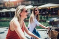 Two beautiful women shopping on bike Royalty Free Stock Photo