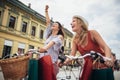 Two beautiful women shopping on bike in the city Royalty Free Stock Photo