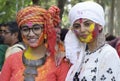 Two beautiful women smeared with holi colours.